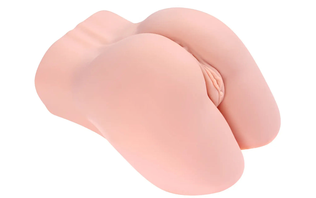 Pink silicone butt plug kokos real hip hera with realistic contours and textured surface shown from the back side