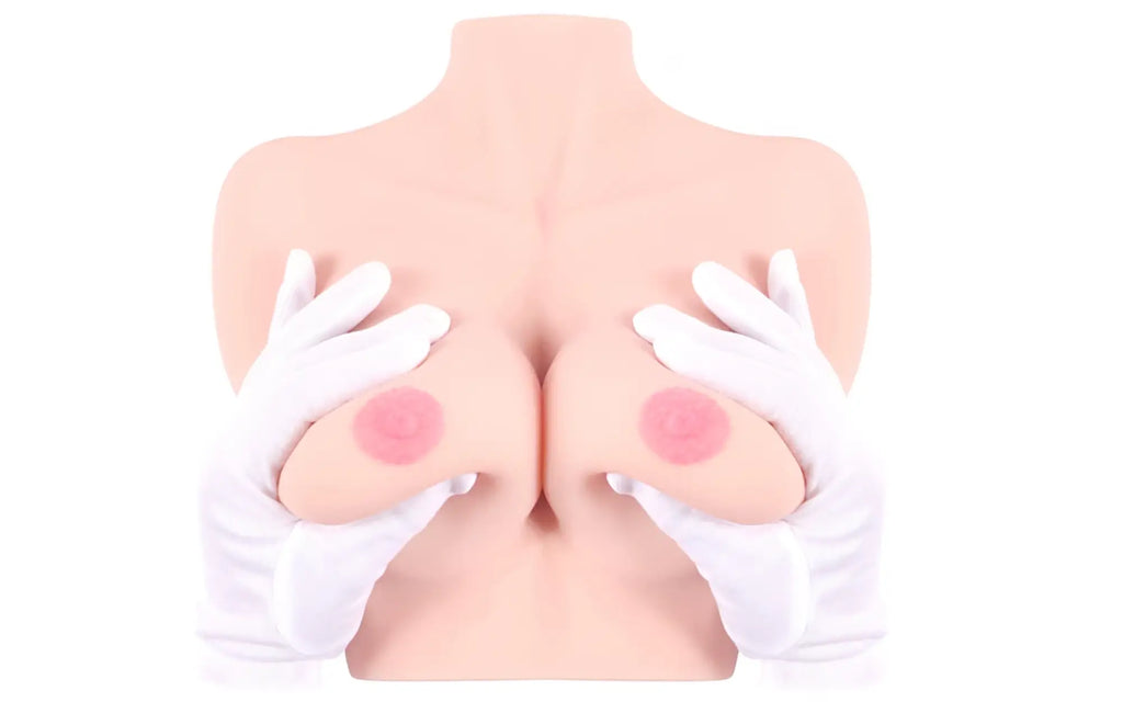 Pink silicone breast model with circular pink pads on each side from kokos real titties d cup displayed on white background
