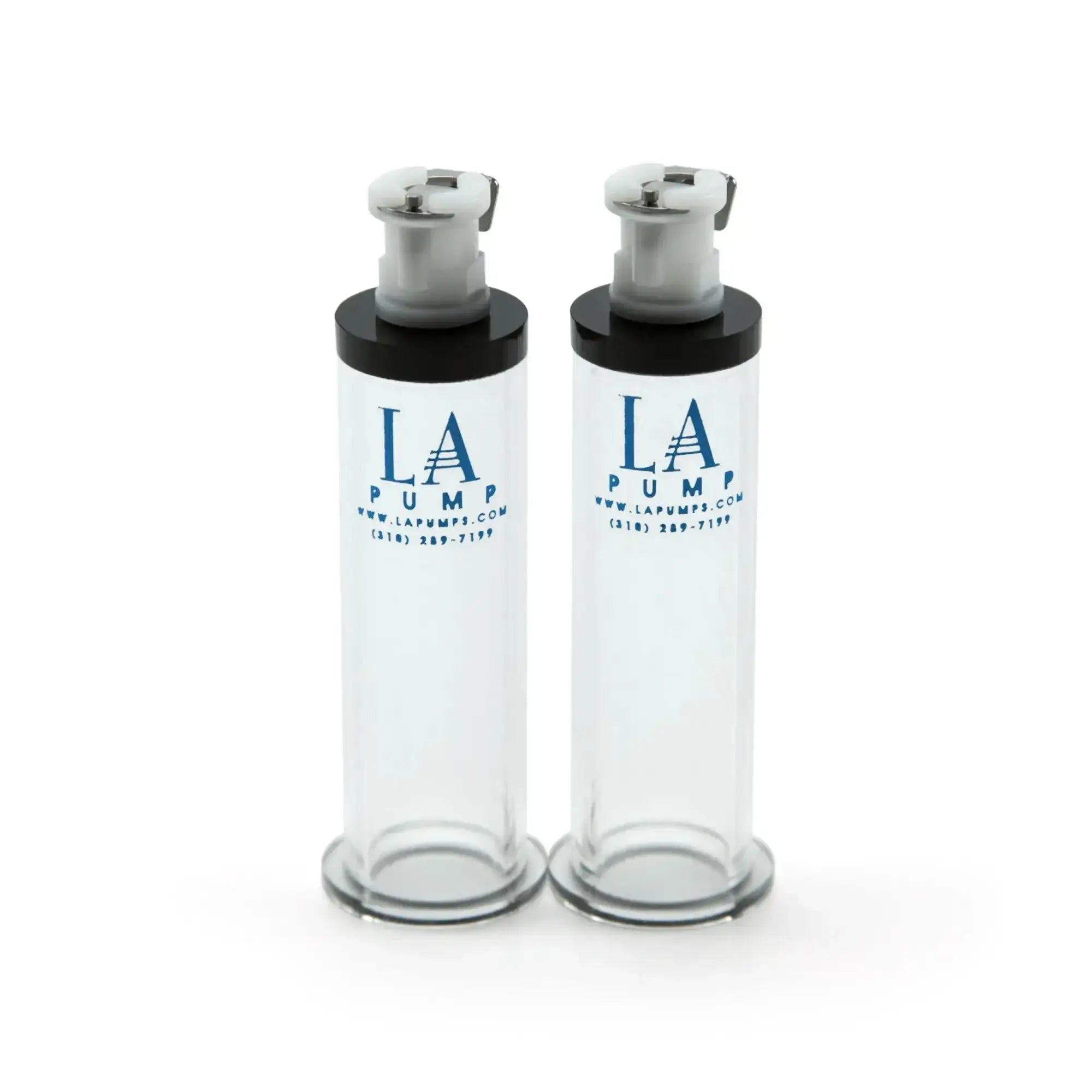 Two transparent glass la pump nipple enlargement cylinders with black caps and silver pump mechanisms 16mm diameter