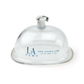Clear glass suction cup vulva cylinder with white plastic valve and blue la pump branding in premium s size