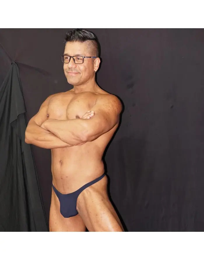 Navy thong underwear on a model featuring a minimal design made of soft fabric by Arroyman.