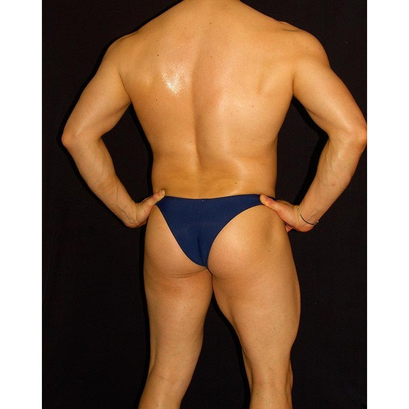 Navy blue men's bikini underwear by Arroyman featuring a snug fit and minimal coverage shown from the back on a model.
