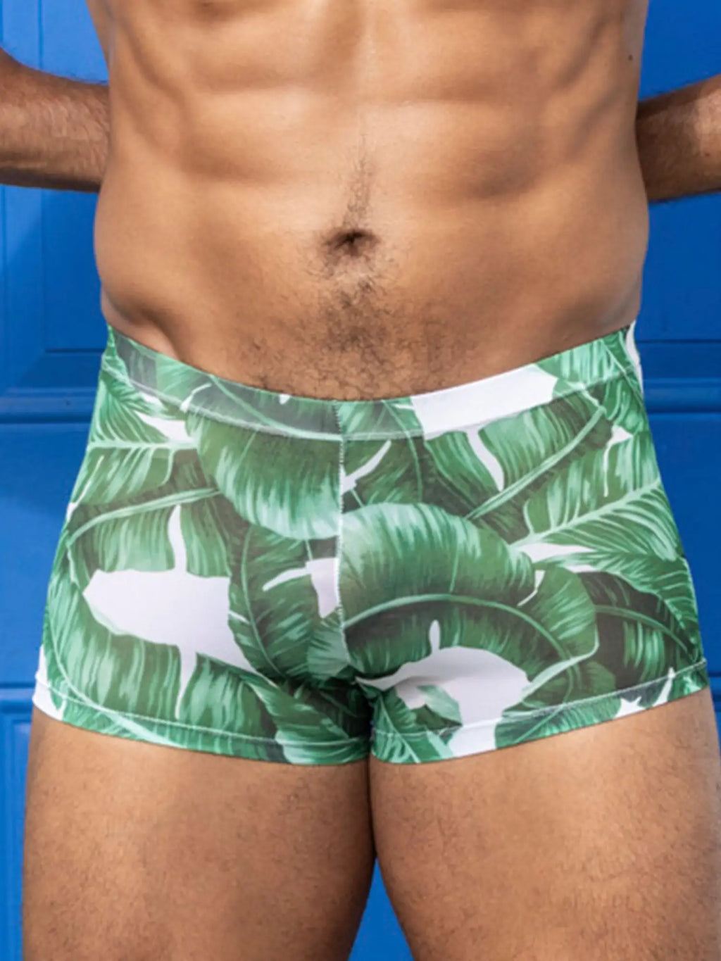 Little boy blue design chris square cut swim trunks with green and white tropical leaf pattern and mesh fabric