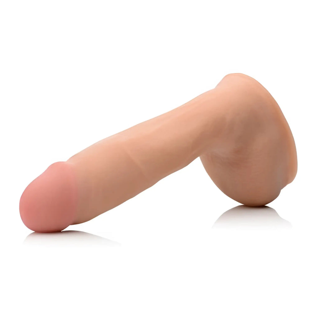 Beige silicone realistic male genital model of loadz 8in dual density squirting dildo with balls reservoir shown from back side