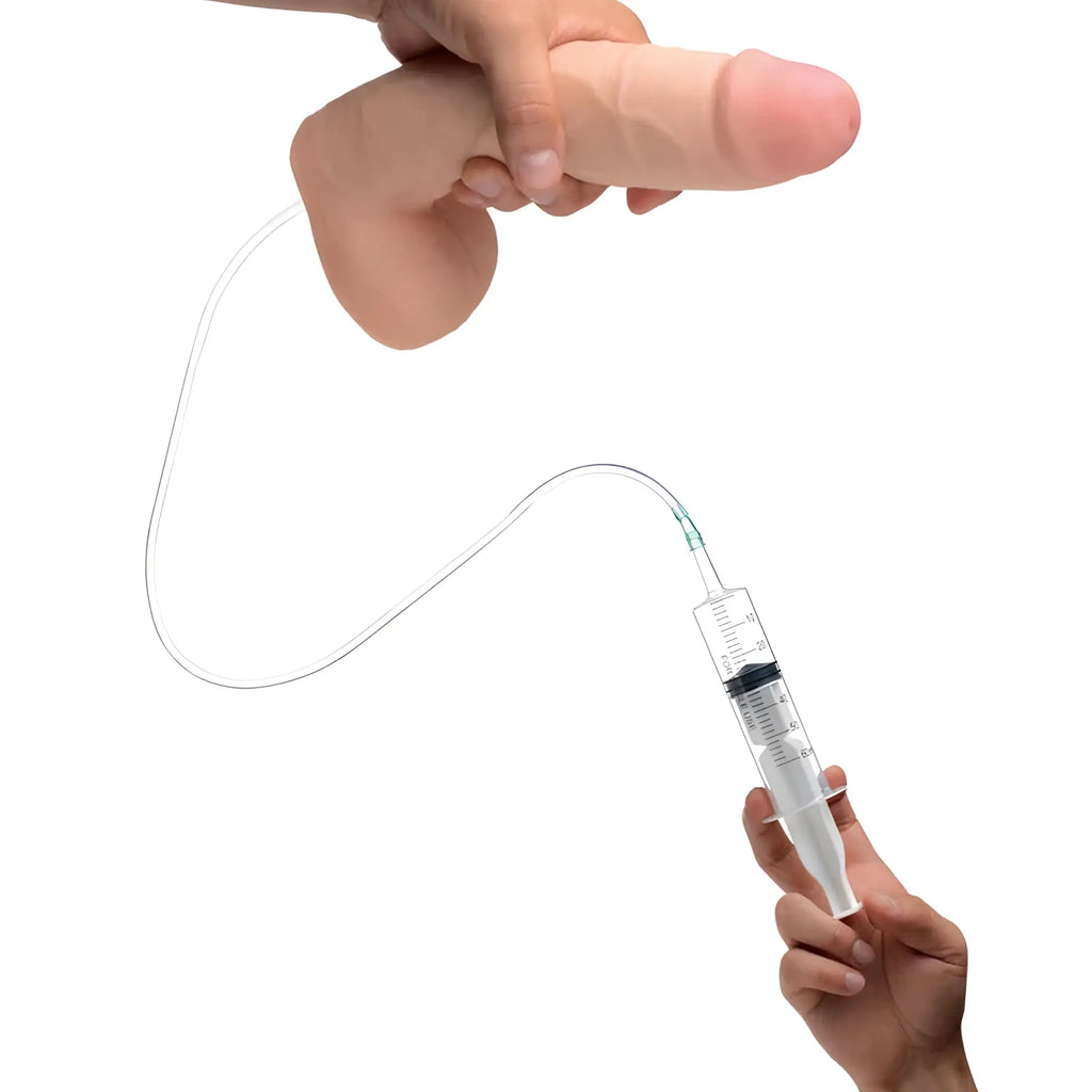 Pink silicone loadz squirting dildo 9in with attached clear tubing and syringe for manual stimulation