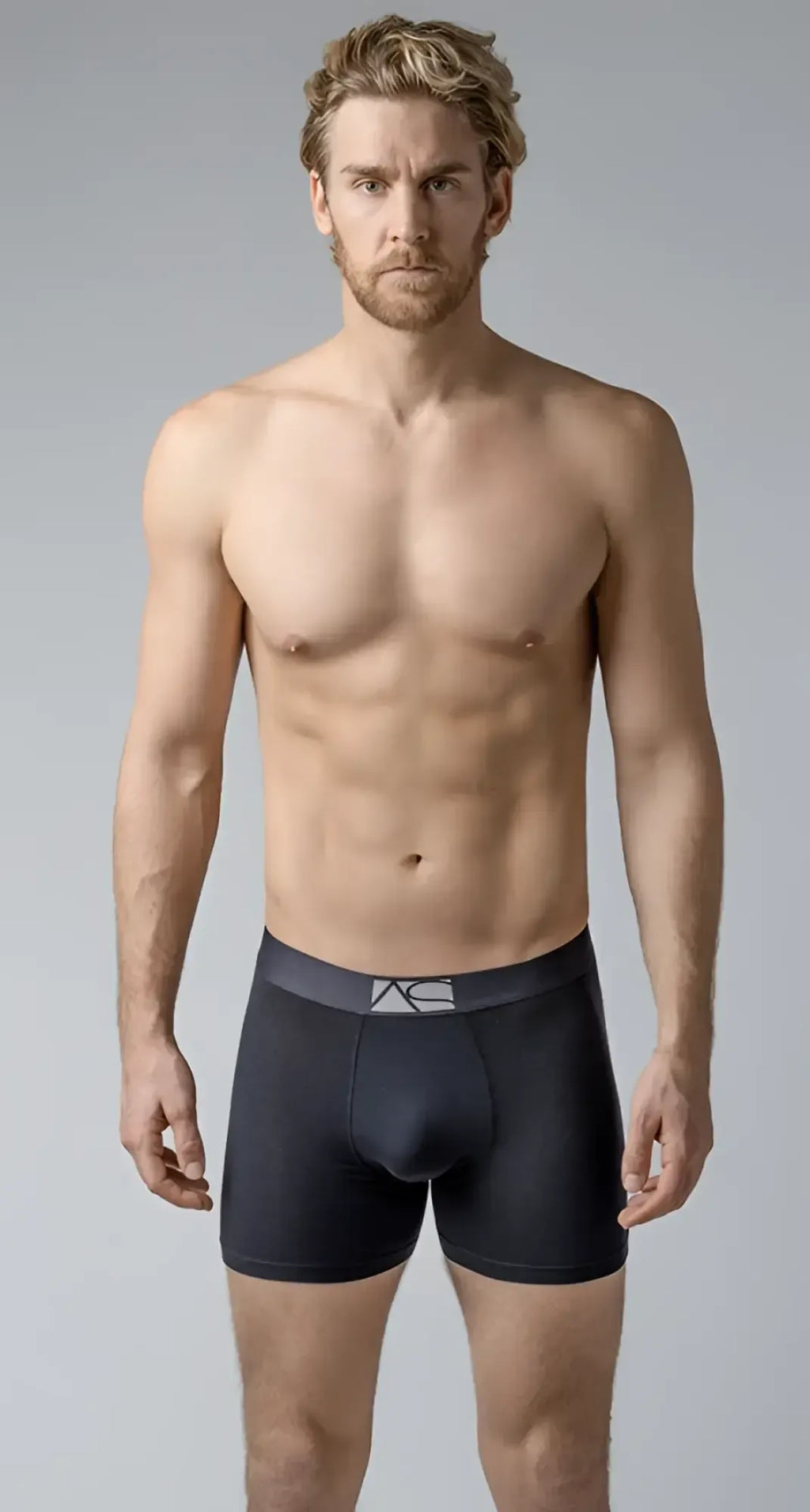 Black menâs long trunks boxer briefs with a dark gray waistband and subtle white logo for comfortable support