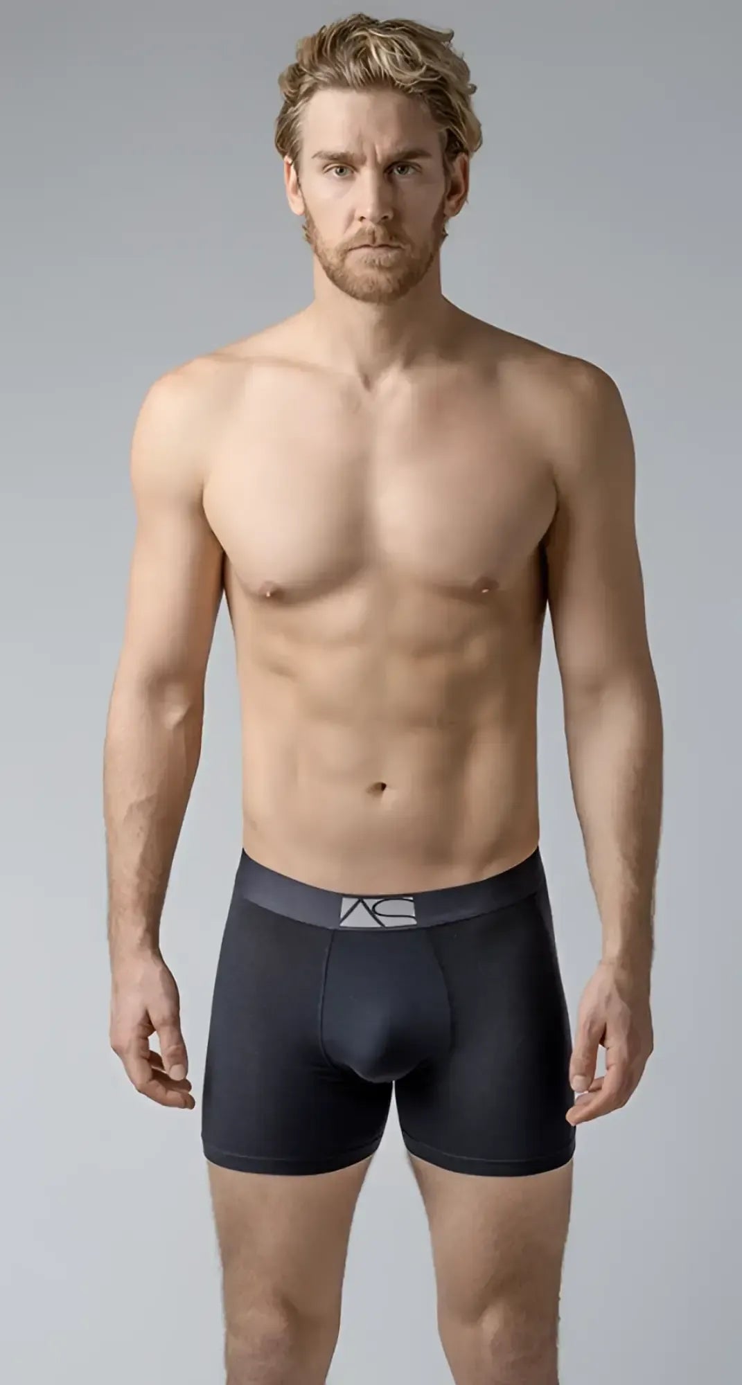 Black menâs long trunks boxer briefs with a dark gray waistband and subtle white logo for comfortable support