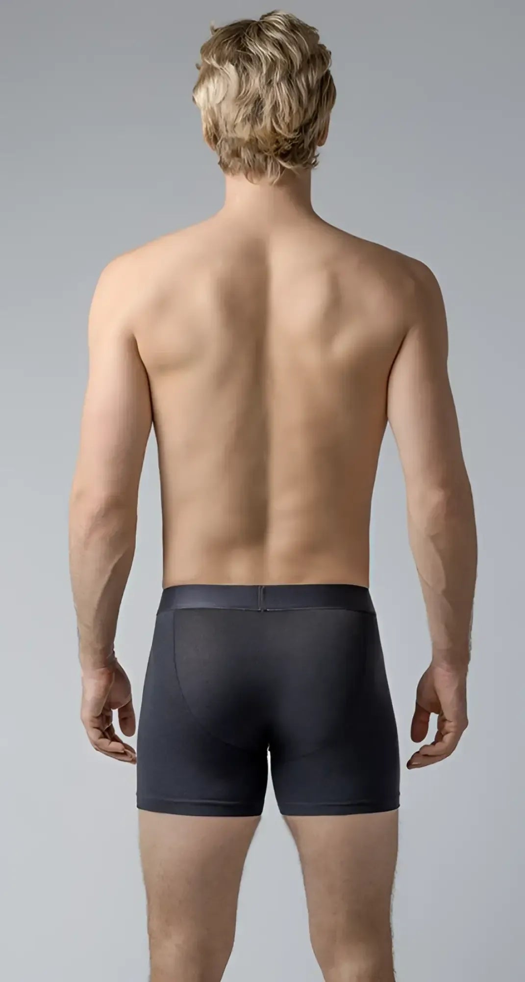 Black menâs long trunks boxer briefs with smooth form-fitting fabric and subtle waistband seam in black color