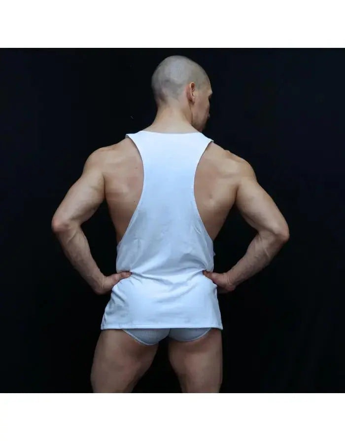 White loose muscle tank top made of cotton shown from the back on a model by Arroyman highlighting arm and shoulder design.