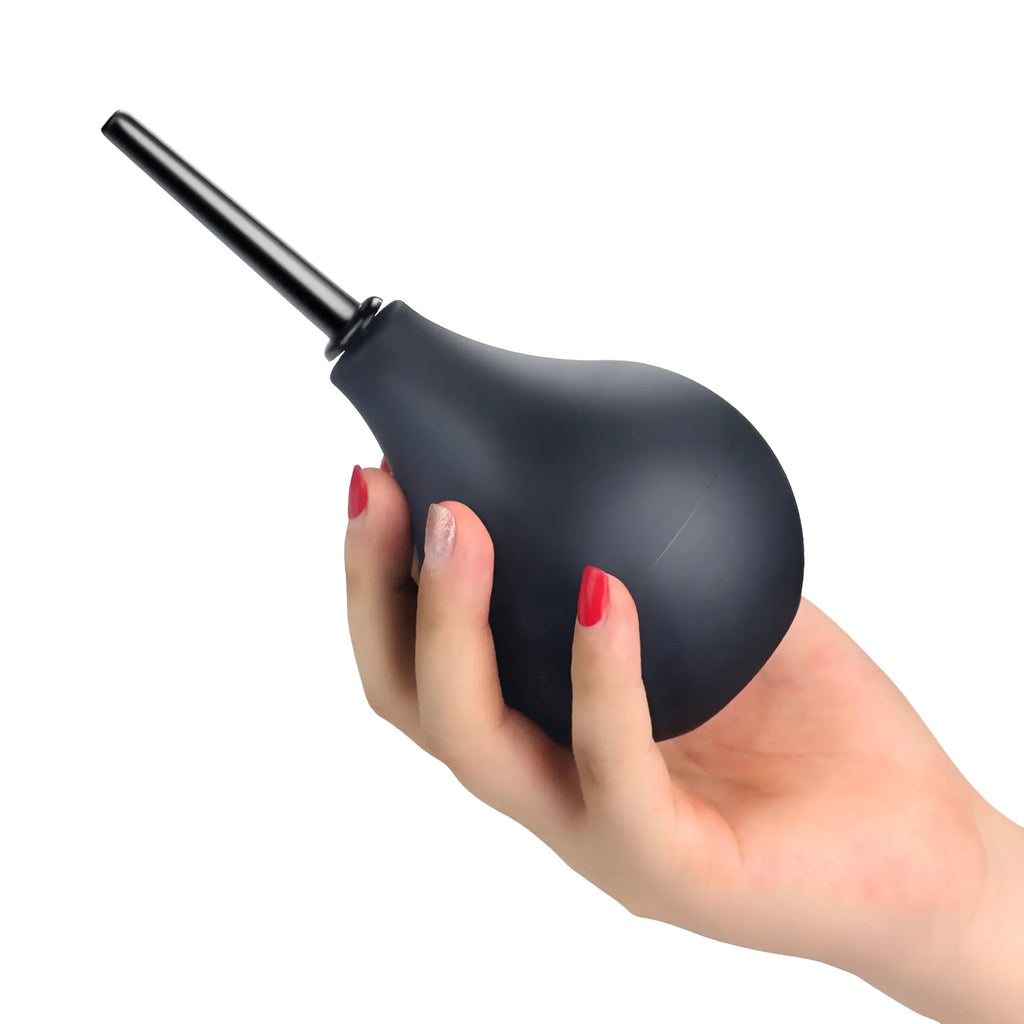 Black rubber bulb douche with a slender black nozzle held in hand from Lovetoy Deluxe Impulse 160ml product