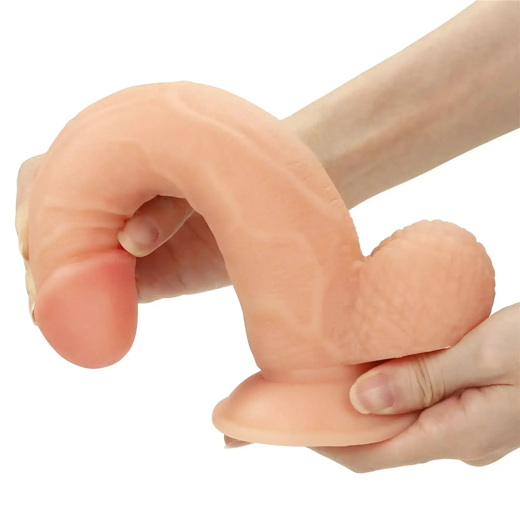 Peach-colored silicone adult toy with realistic texture and contours from lovetoy easy strap on set 8.5in