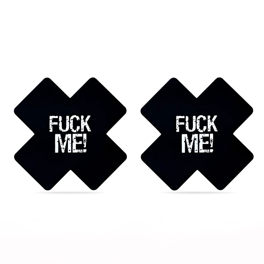 Black x-shaped adhesive breast pads with bold white fuck me text in distressed font lovetoy fuck me cross pattern nipple pasties twin pk