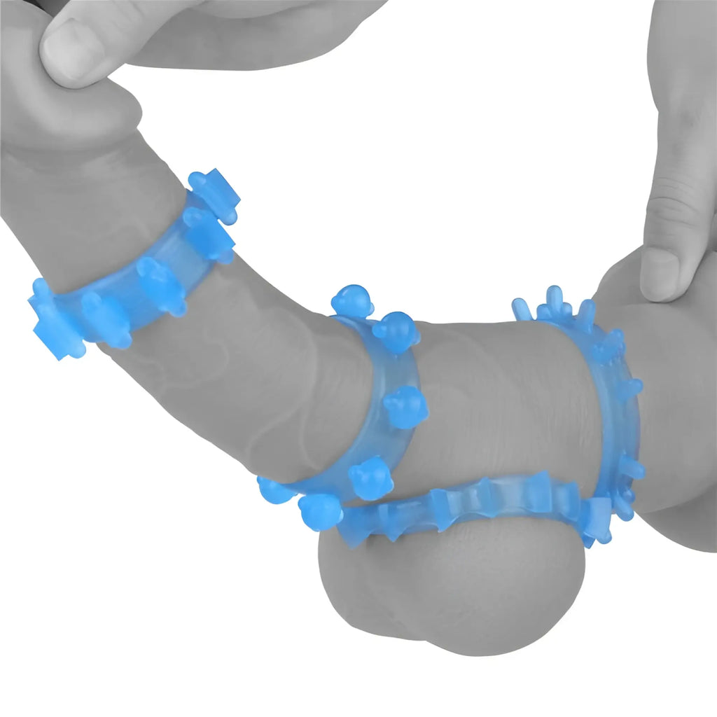 Blue silicone lovetoy lumino play penis ring with textured spike-like protrusions for enhanced stimulation