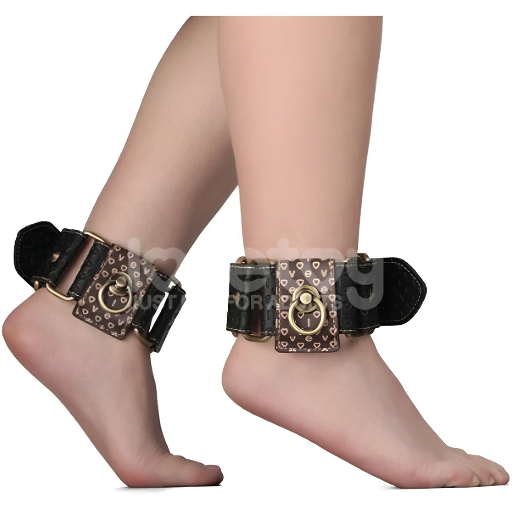 Lovetoy rebellion reign ankle cuffs featuring brown pattern with black leather accents and gold-tone metal rings