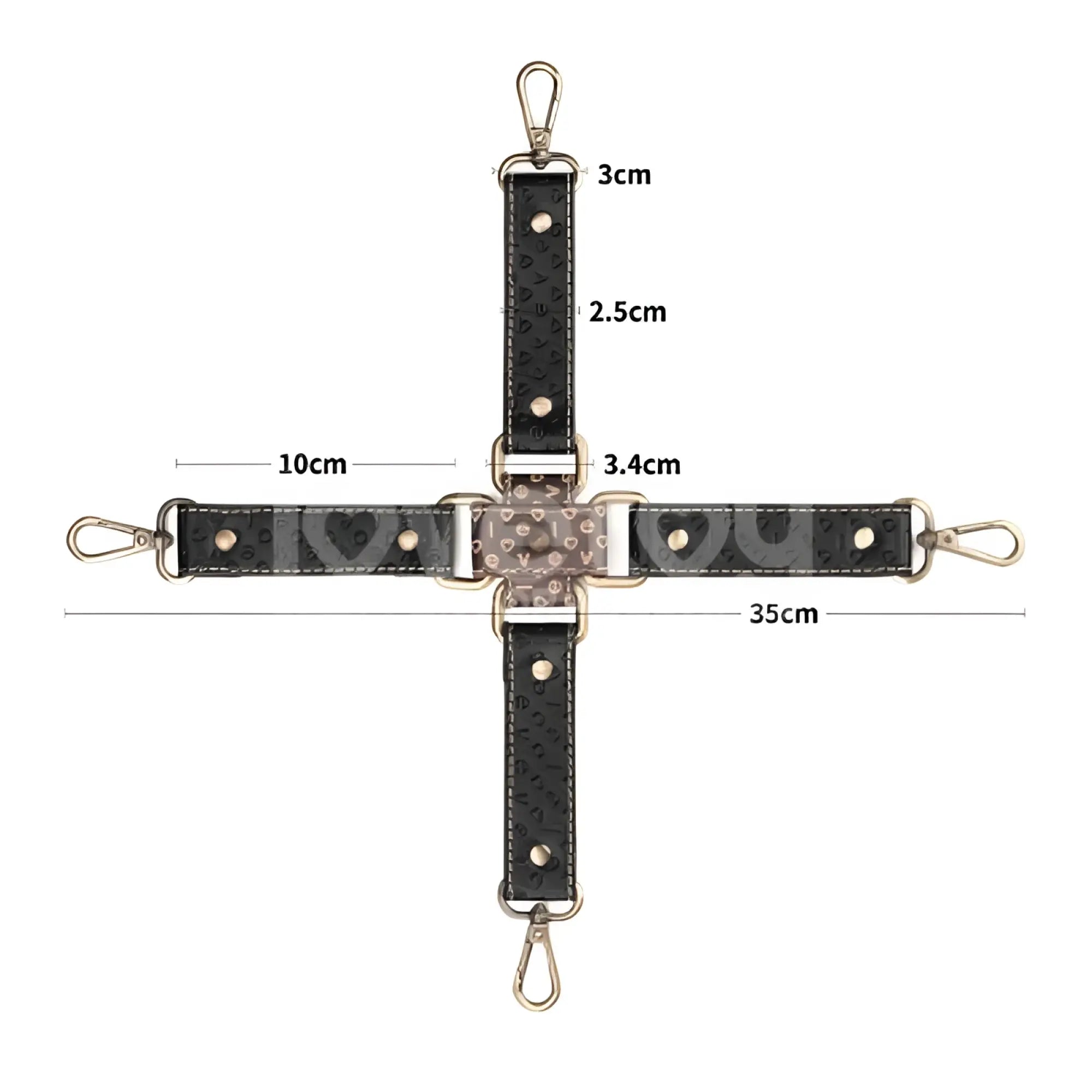 Black textured leather crossbody strap with gold-tone hardware and heart-shaped embellishments for lovetoy rebellion reign hogtie set