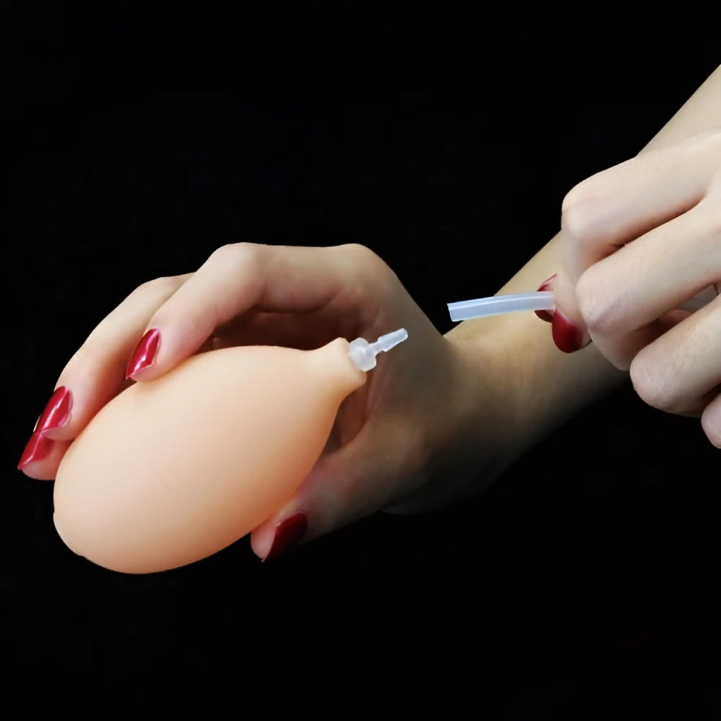 Peach-colored silicone lovetoy soft ejaculation cock with ball 8.5in featuring clear plastic nozzle and tube