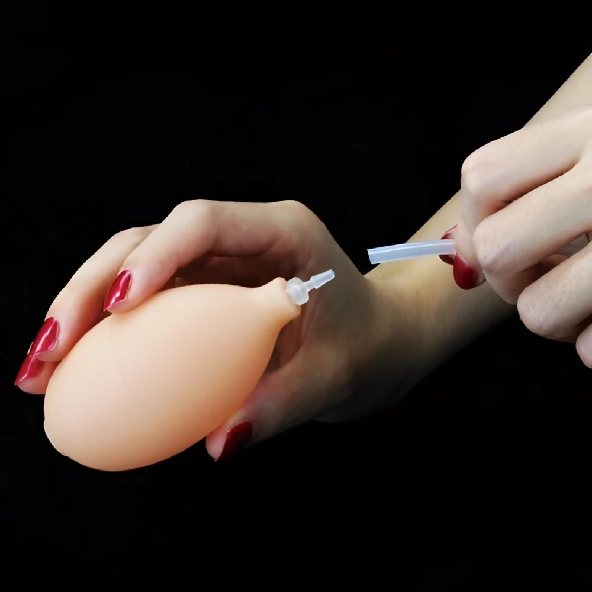 Peach-colored silicone lovetoy soft ejaculation cock with ball 8.5in featuring clear plastic nozzle and tube