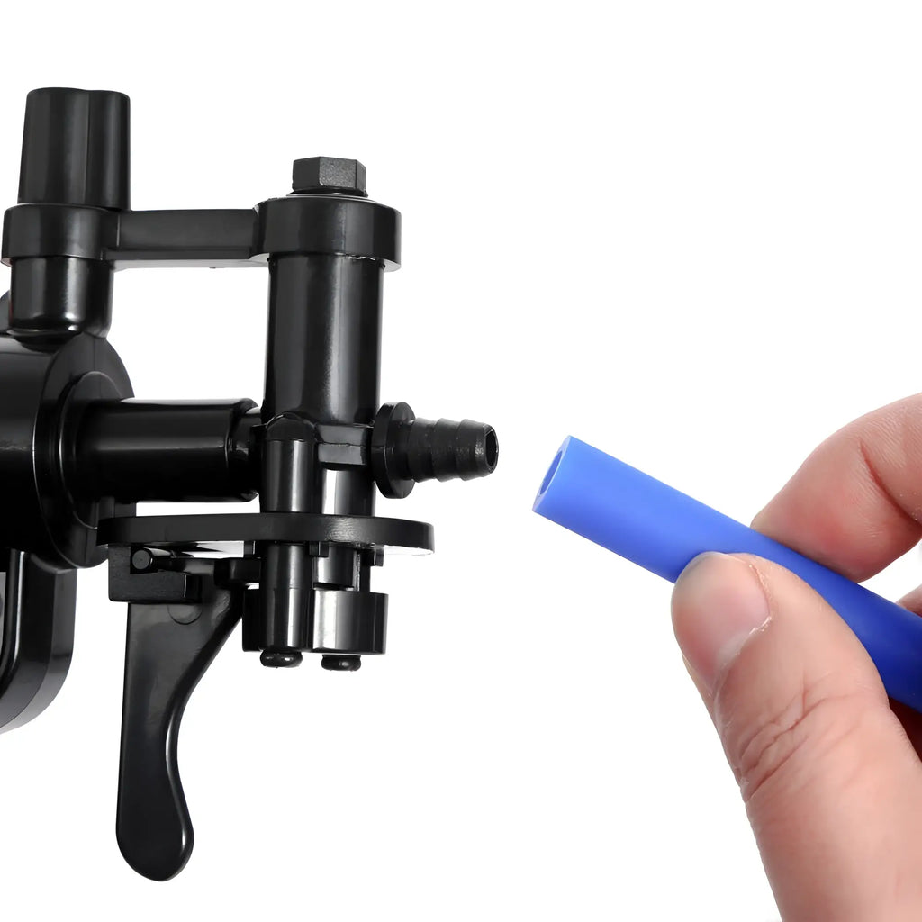 Black plastic beer tap with blue silicone tube held nearby in luvpump nipple clit and penis pump kit for couples optimax m