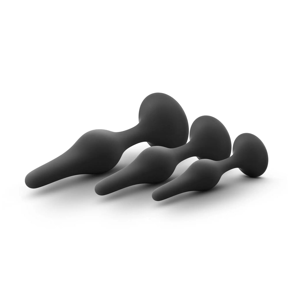 Set of three black silicone butt plugs in varying sizes with smooth rounded contours from luxe luxe beginner plug kit