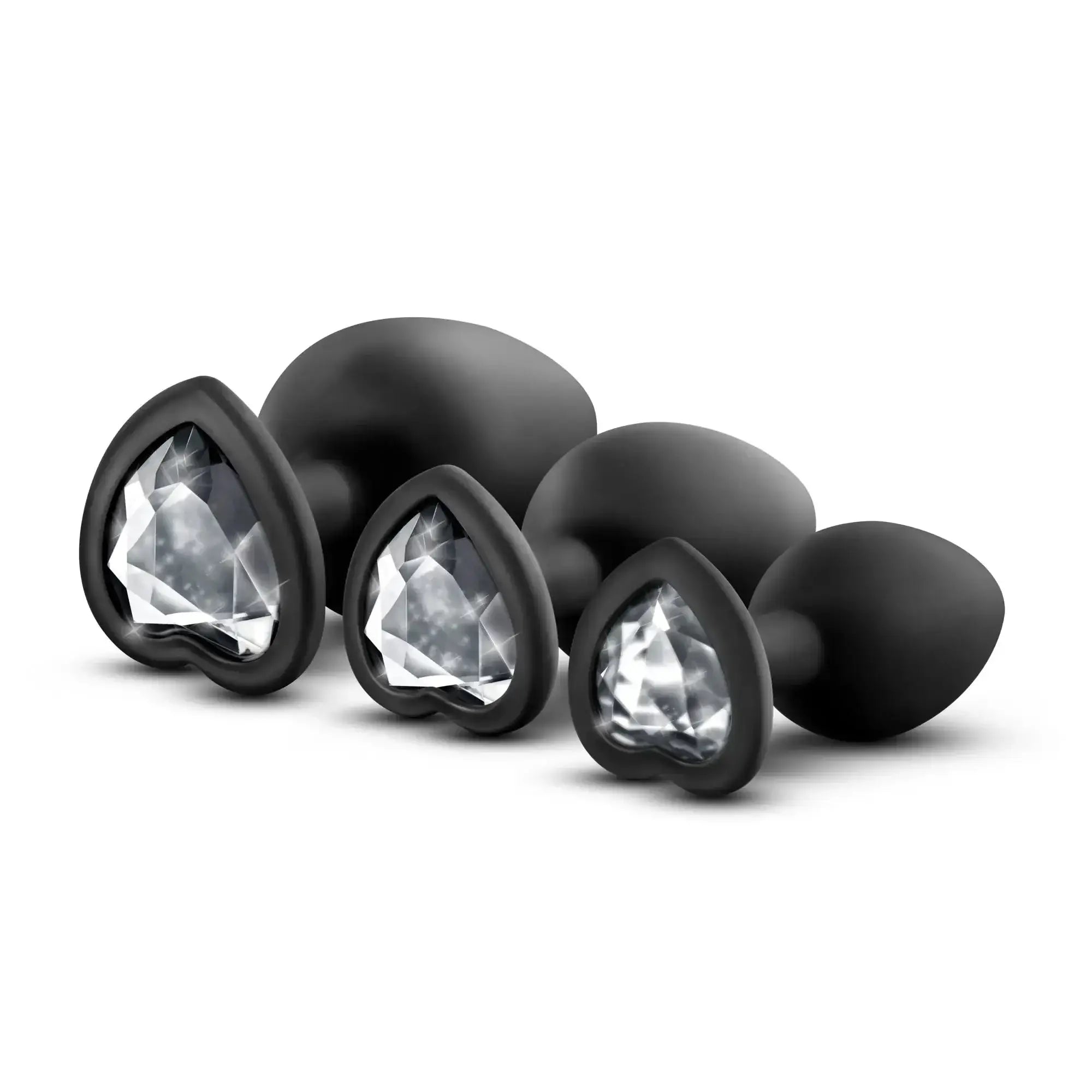 Set of black heart-shaped anal plugs with clear crystal-like inserts luxe luxe bling plugs training kit black with clear gems
