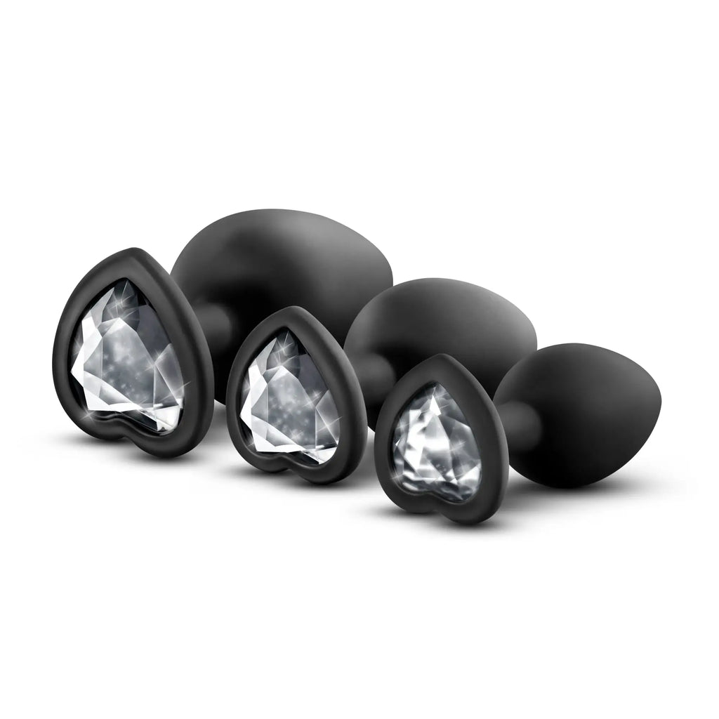 Set of black heart-shaped anal plugs with clear crystal-like inserts luxe luxe bling plugs training kit black with clear gems
