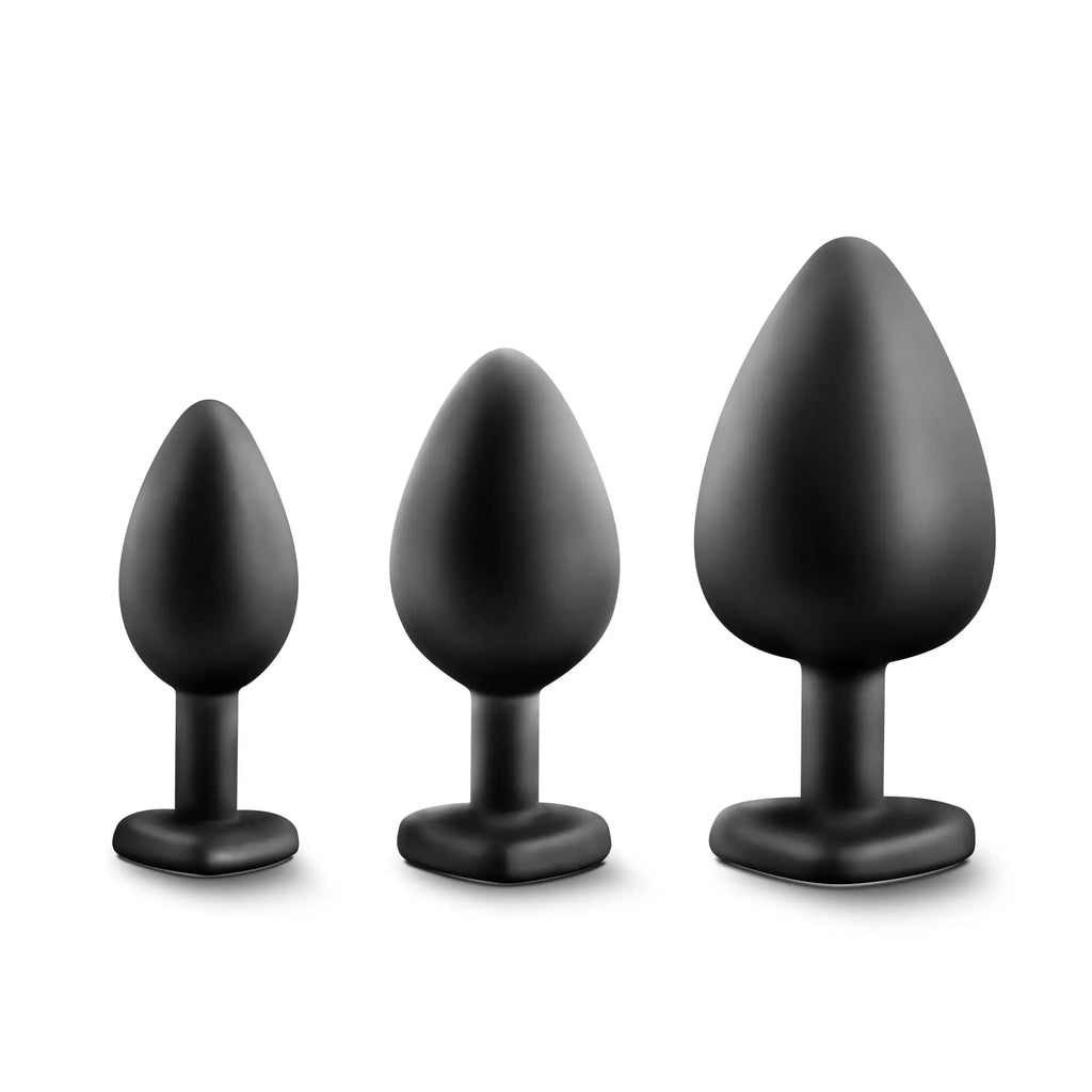 Set of three black silicone butt plugs with clear gems in varying sizes and flat bases from luxe luxe bling plugs training kit