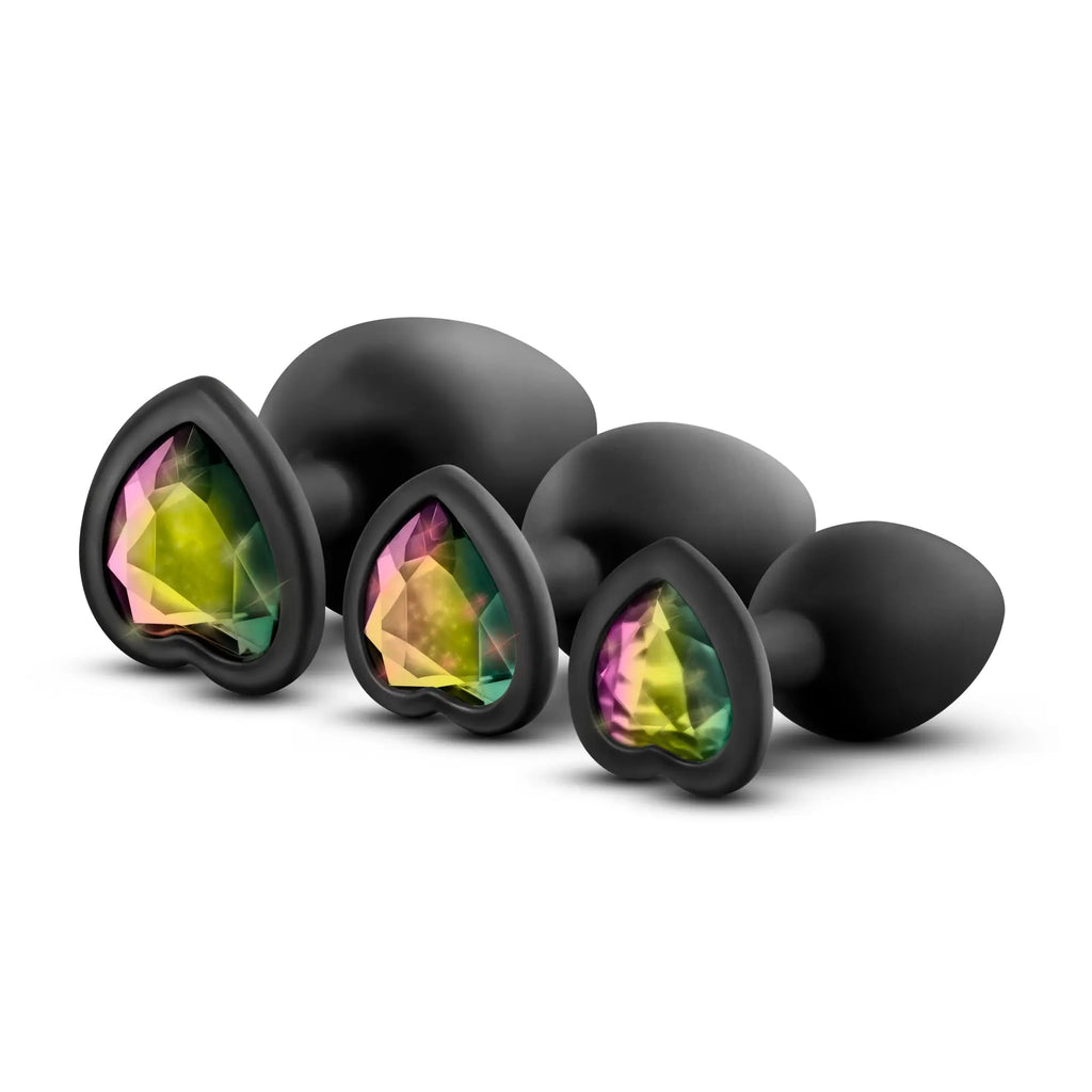 Set of three black heart-shaped anal plugs with iridescent rainbow gemstone inserts luxe bling plugs training kit
