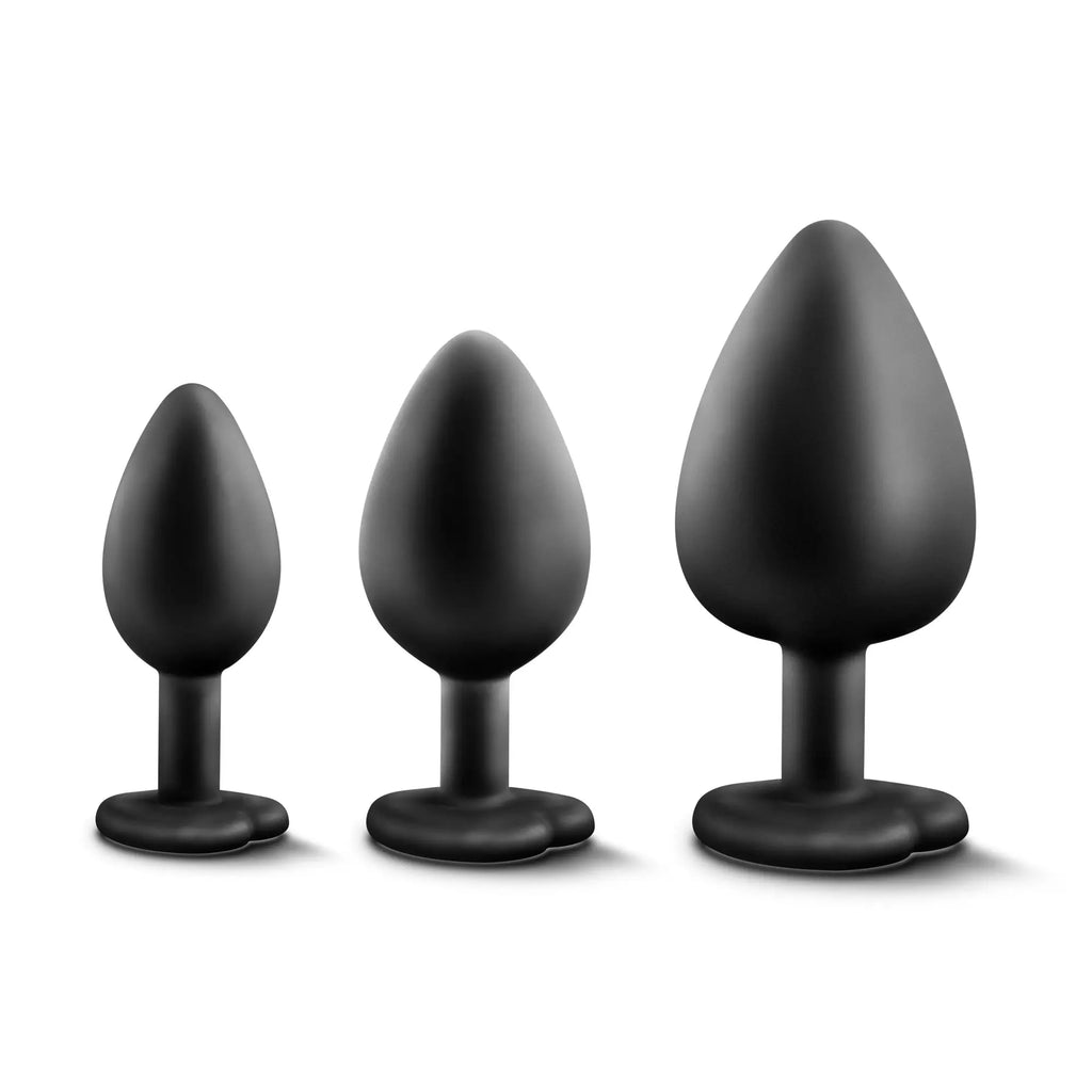 Set of three black silicone Luxe Luxe bling plugs with rainbow gems in varying sizes for training use
