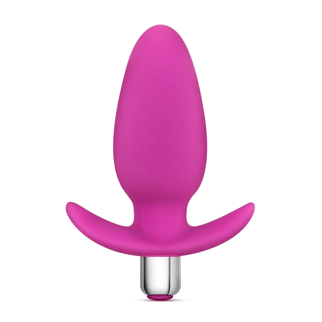 A vibrant pink silicone Luxe Luxe Little Thumper butt plug with a sleek ergonomic design and metallic silver base