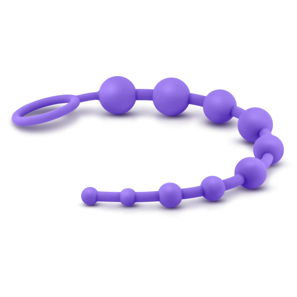 Purple luxe luxe silicone 10 beads train with looped handle made of soft silicone for sensory play and teething
