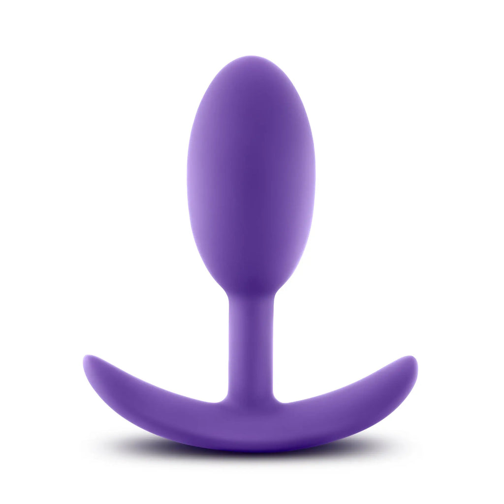 Purple silicone butt plug with curved stable base from luxe luxe wearable vibra slim plug medium purple collection
