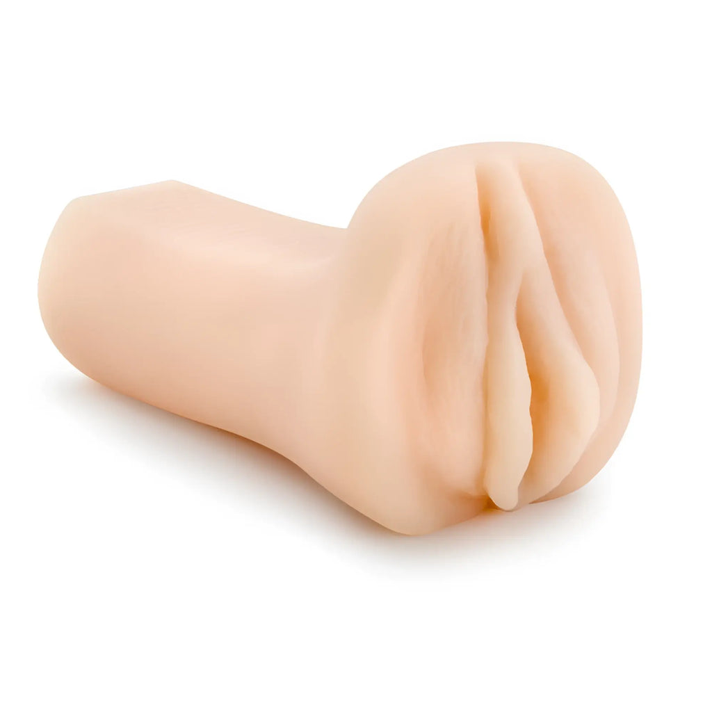 Beige silicone anal plug with realistic textured surface and tapered design from m for men minx collection