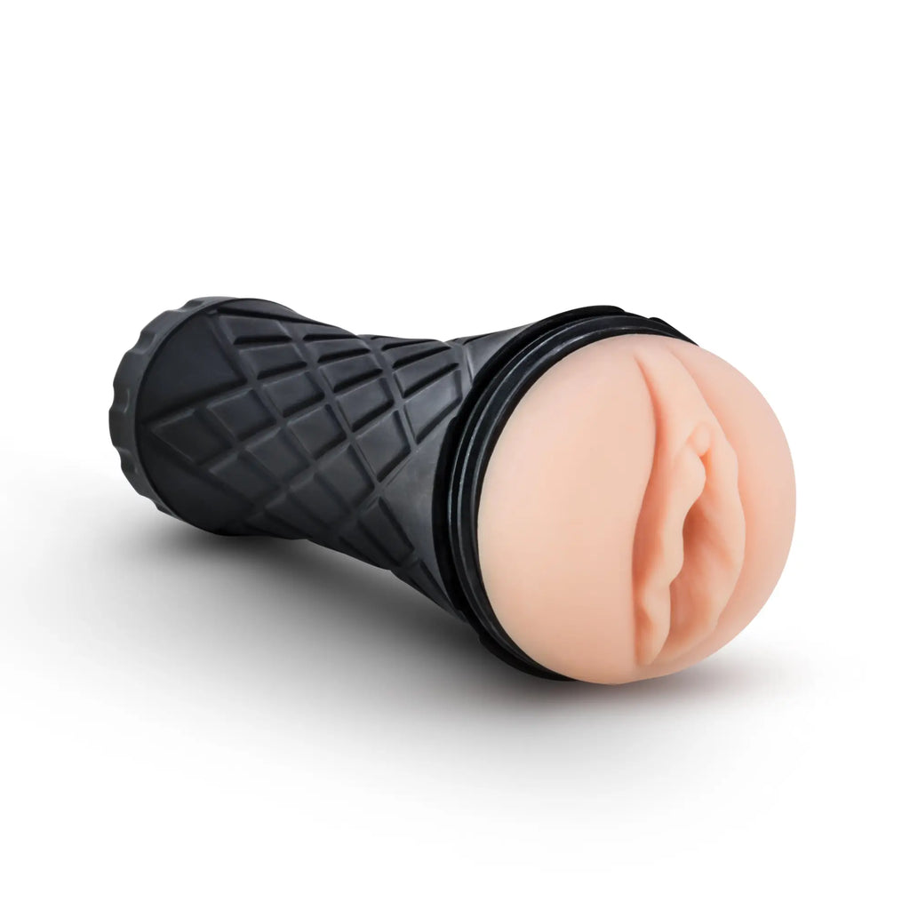 Black textured handle with peach silicone head resembling an ice cream cone in m for men the torch pussy vanilla product