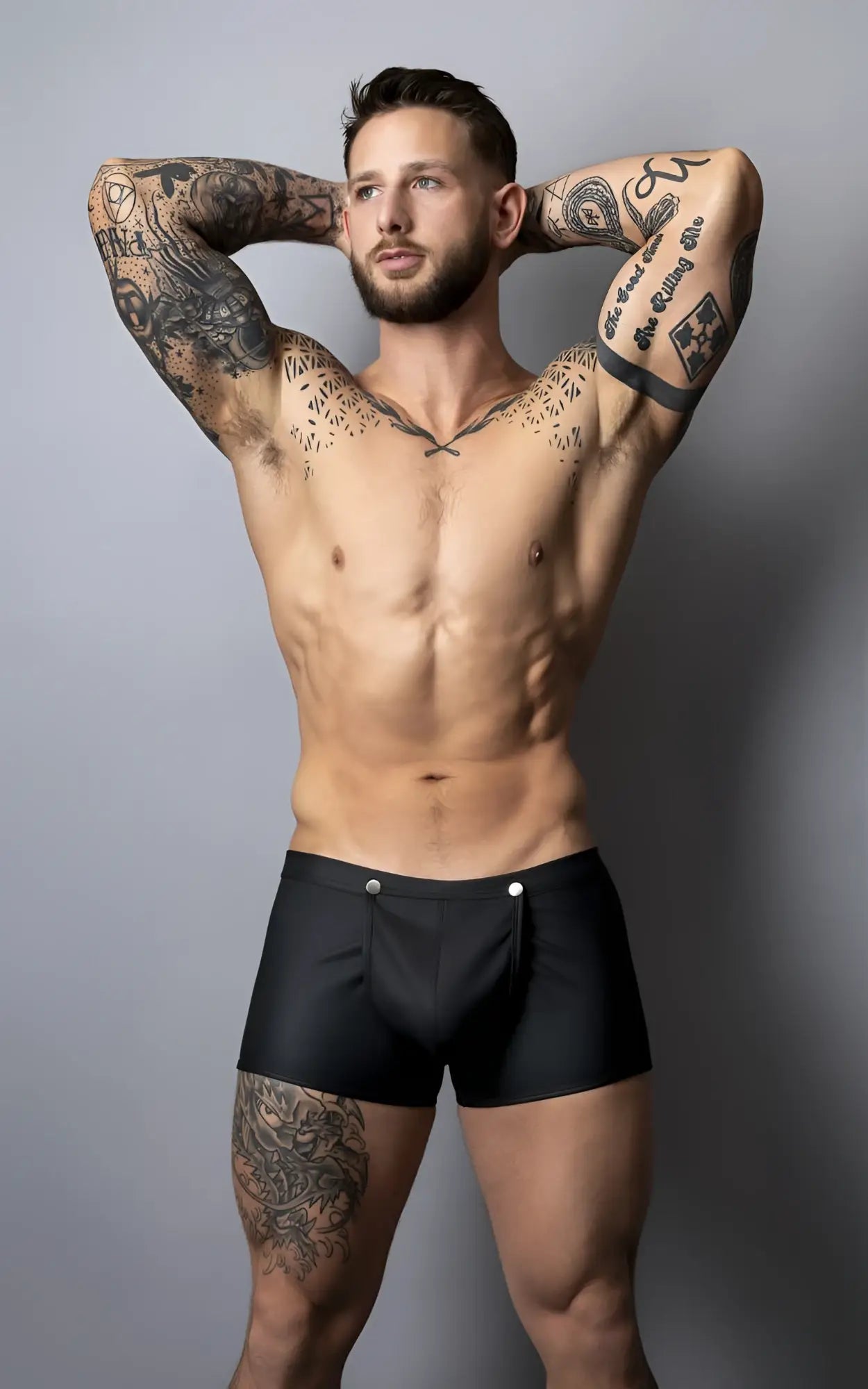 Black male power briefs with silver snap buttons designed for easy snap off in a stylish short fit