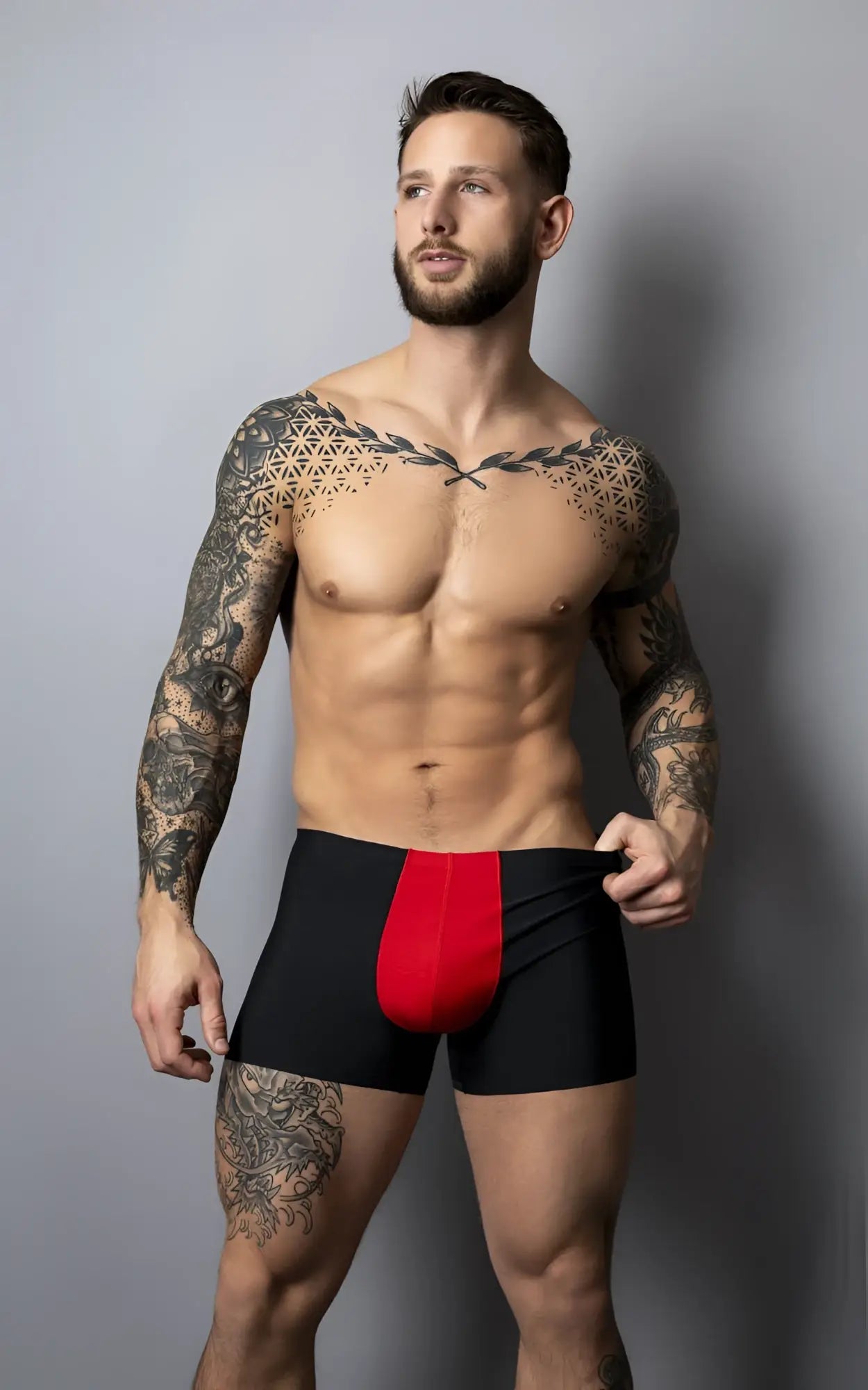 Male power 154-300 hot mesh pouch short in black and red with bold vertical red panel and breathable mesh fabric