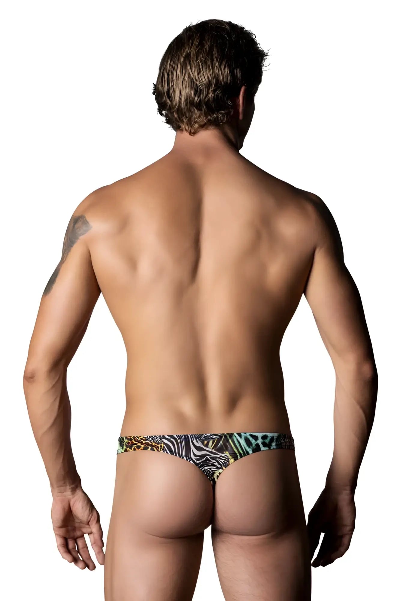A man wearing male power 439-295 go wild thong with colorful zebra and leopard print patterns and two rings