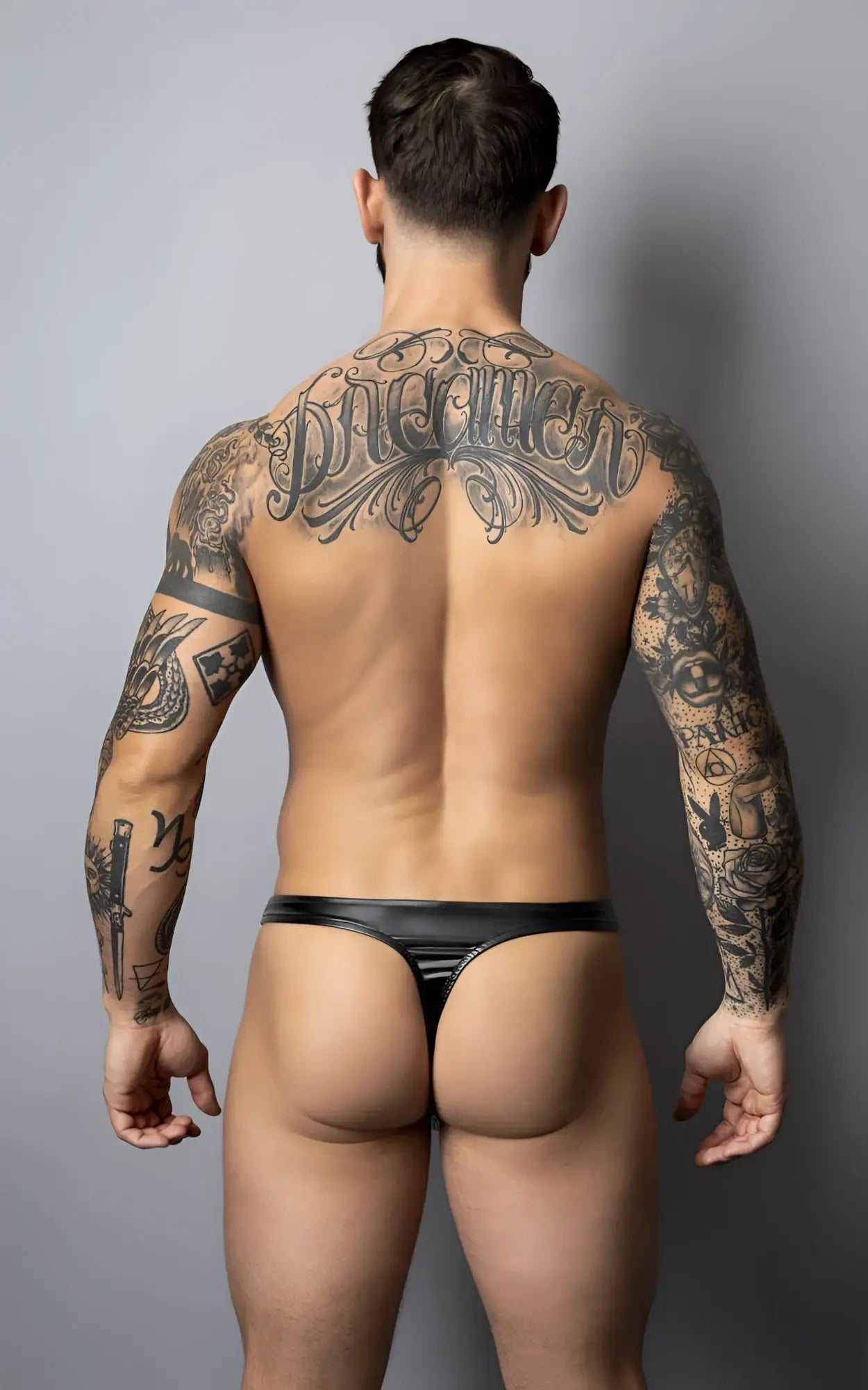 Male power 442-301 liquid onyx 2.0 black thong made of glossy black patent leather shown from the back side
