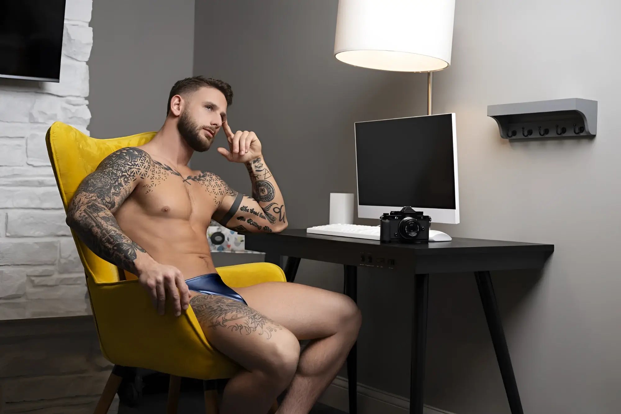 Black classic design camera on desk next to male power 442-301 liquid onyx 2.0 bong thong blue product