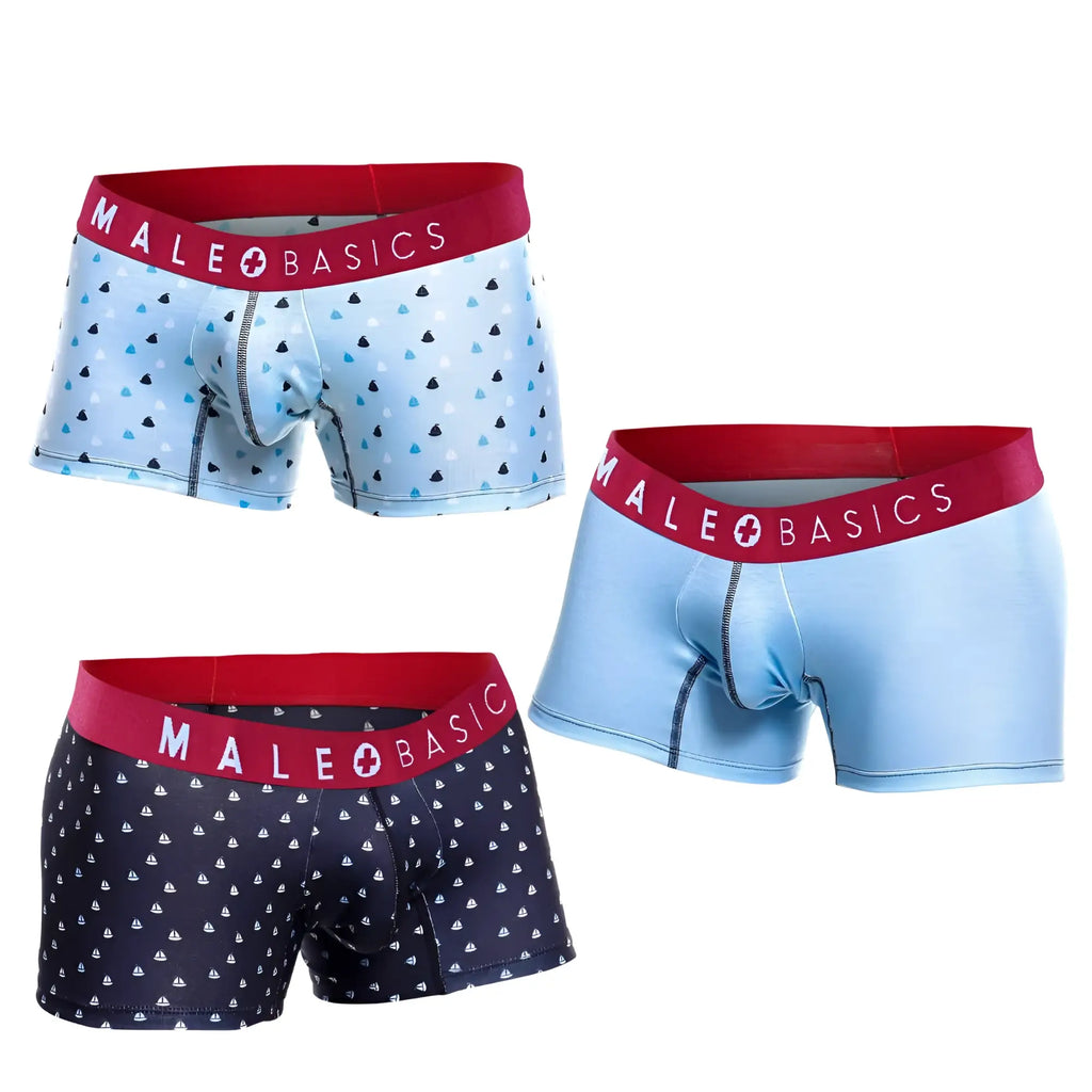 Three MaleBasics 3-pack trunk boxer briefs featuring red waistbands and patterned light blue and navy fabric.