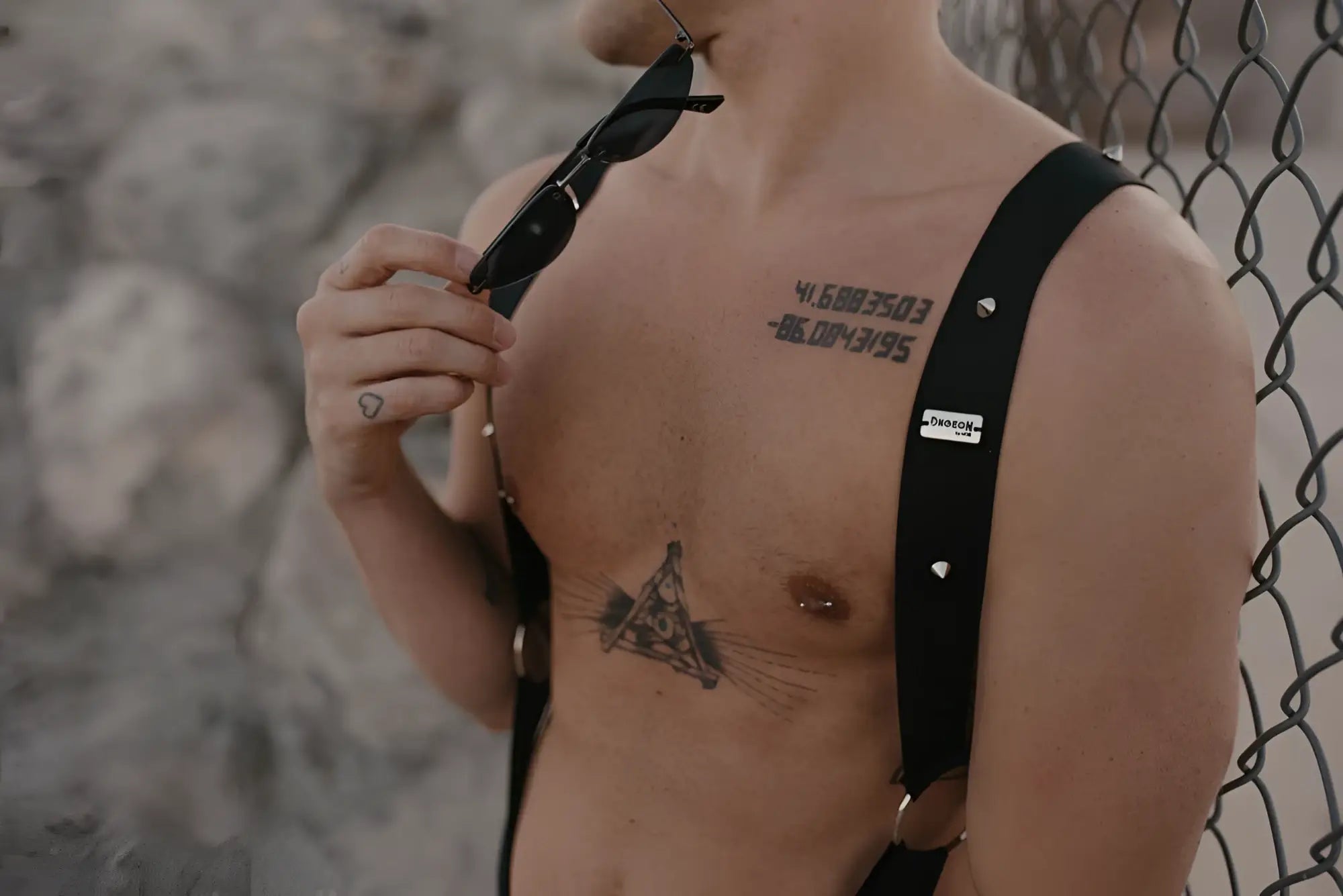 Male basics dmblo5 dngeon crossback harness in black leather with silver studs and small white label visible