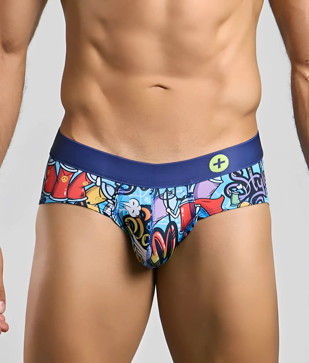 Malebasics hipster brief with vibrant graffiti print and navy blue waistband featuring a small yellow circular logo