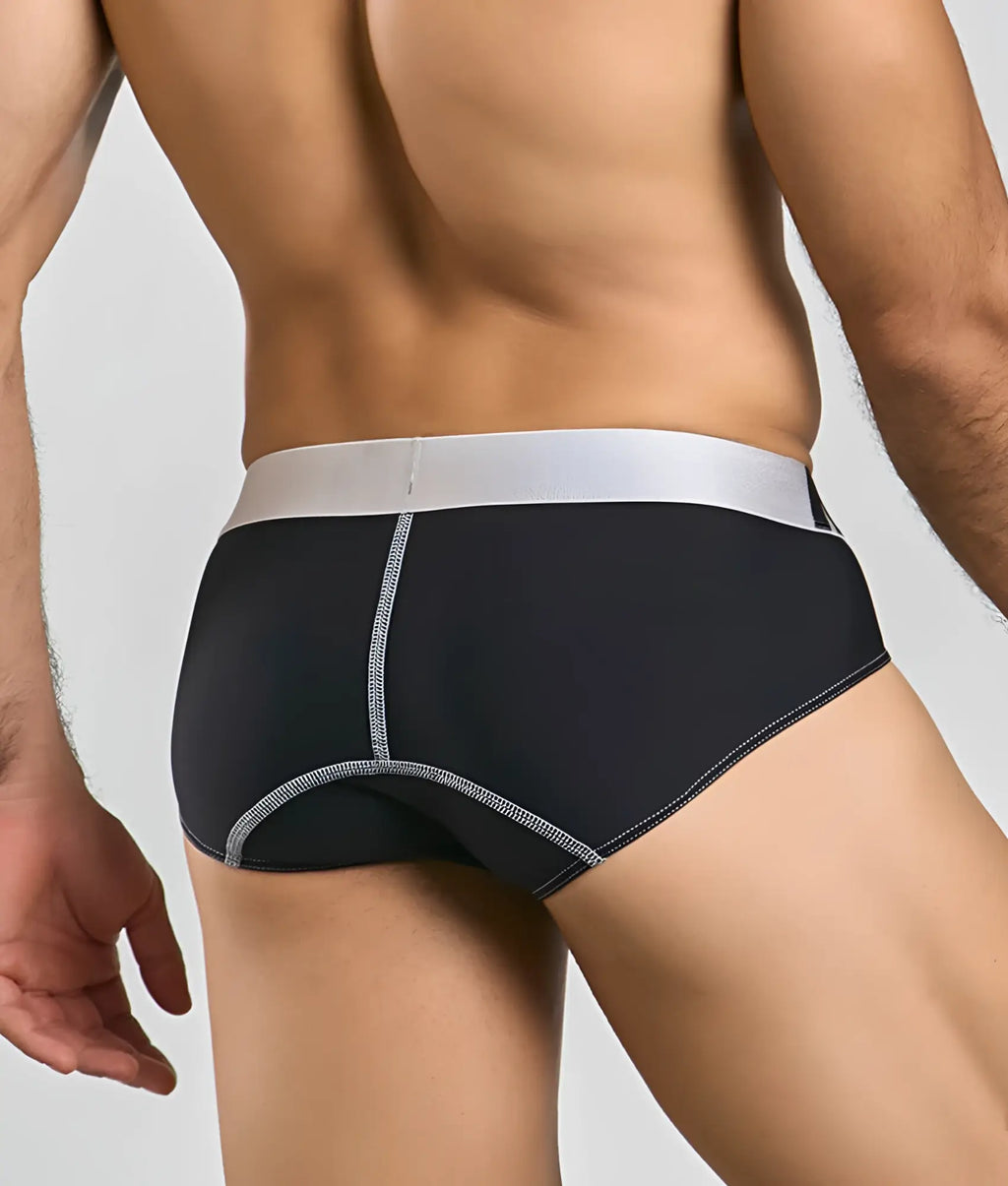 Black microfiber male basics brief with silver waistband and matching stitching details front view