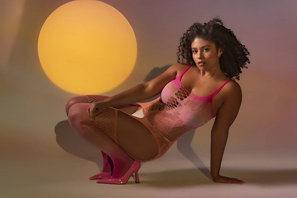 A vibrant pink mesh Mapale 1125X floral ombre bodystocking with thin straps and cutout design in sunset color