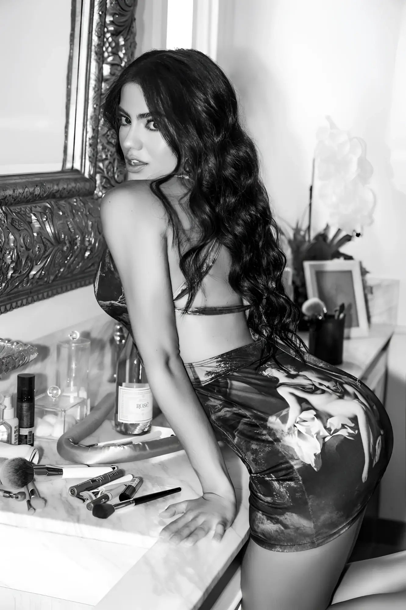 Black and white photo of a woman wearing a glossy high waisted mini skirt with classical painting design mapale 40012 dress