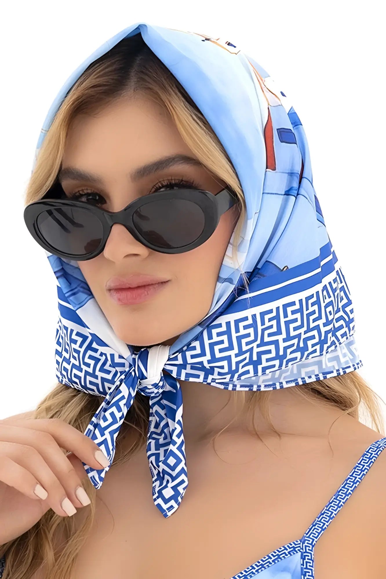A light blue and white geometric patterned headscarf by mapale worn as a fashion accessory in santorini blue