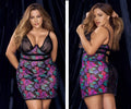 A plus-size woman models a black lace mapale 7497x bodysuit with vibrant floral print on sheer mesh panels