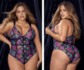 A plus-size mapale 8775x teddy one-piece bodysuit with vibrant purple pink and teal floral print on sheer black mesh