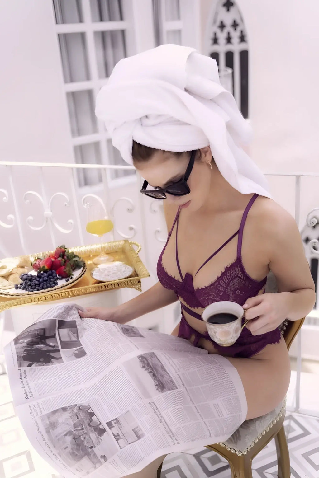 A woman wearing a white towel and black sunglasses models a purple lace lingerie teddy Mapale 8868 color wine