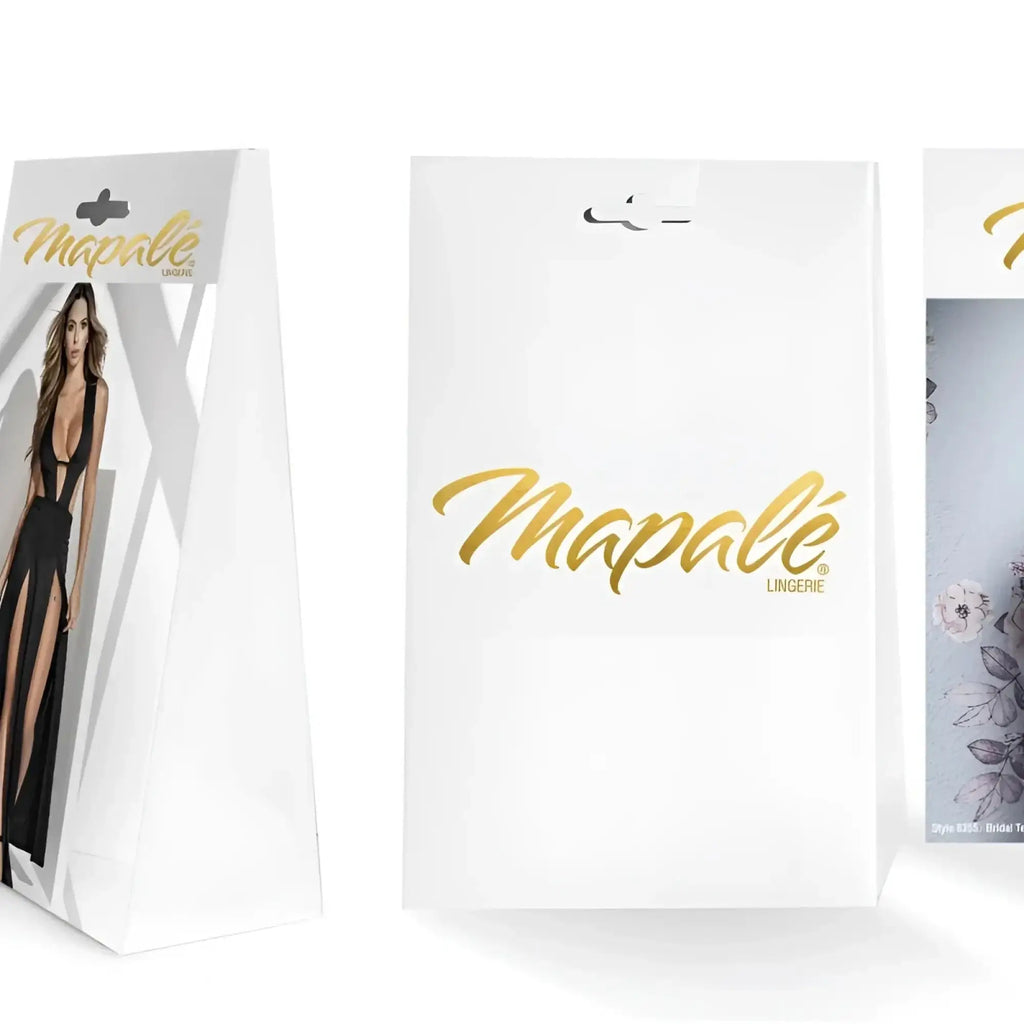 White mapale lingerie packaging with gold foil lettering and model in black lace v back thong XL on front panel