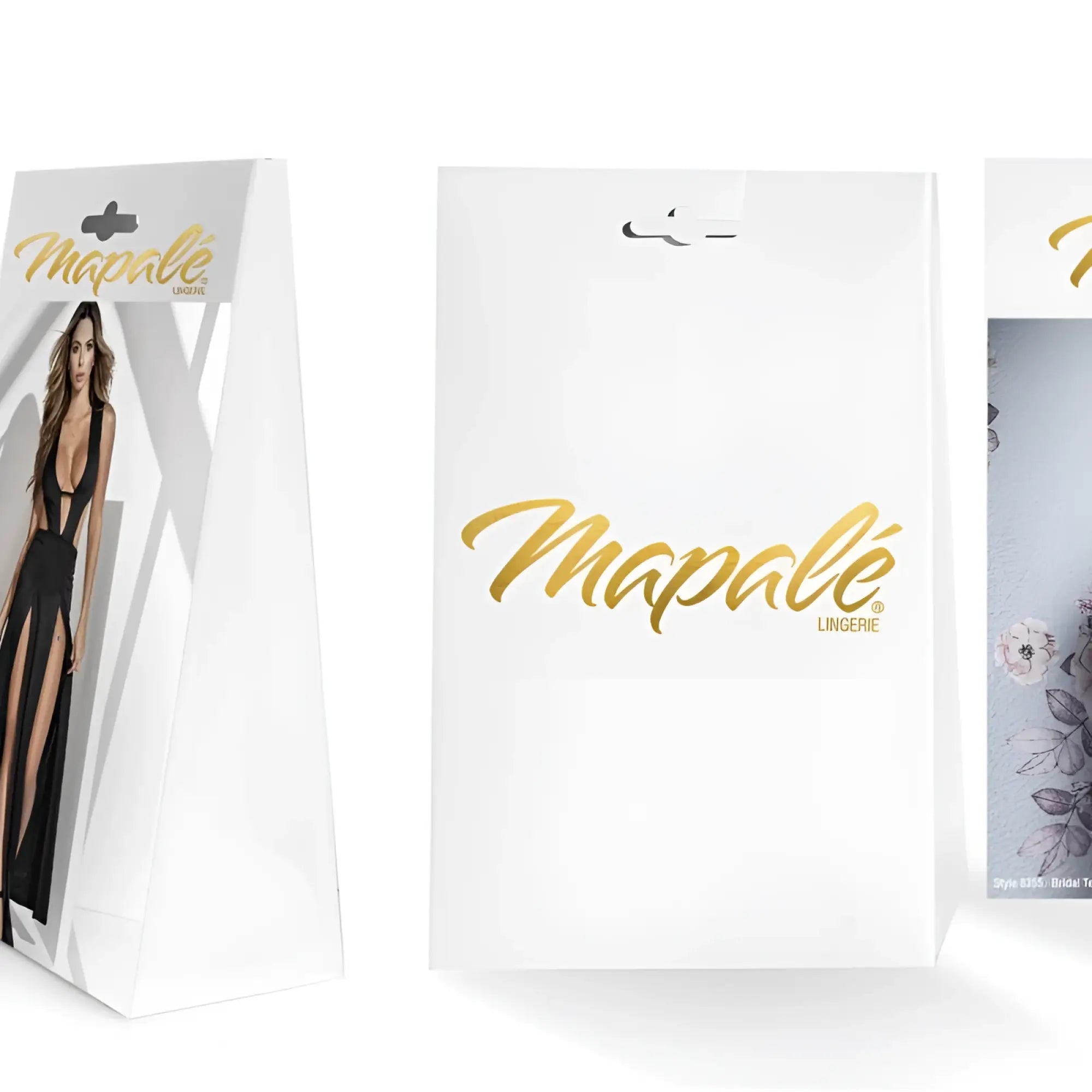 White mapale lingerie packaging with gold foil lettering and a model in black strappy two piece set front panel